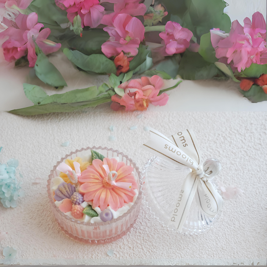 Miss Blooms Flower Bowl Candle with crystal lid closed, showing a garden of wax flowers visible through the transparent dome
