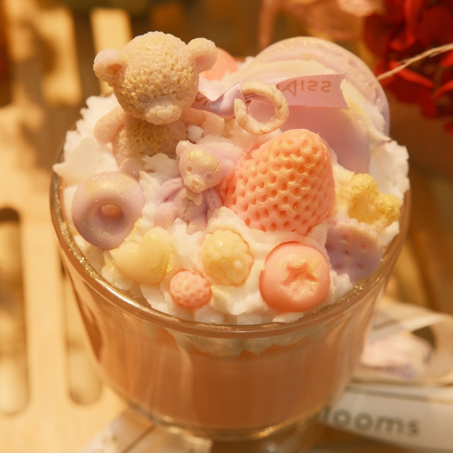 Miss Blooms Giant Sundae Candle top view showing bear, fruit and candy wax arrangement