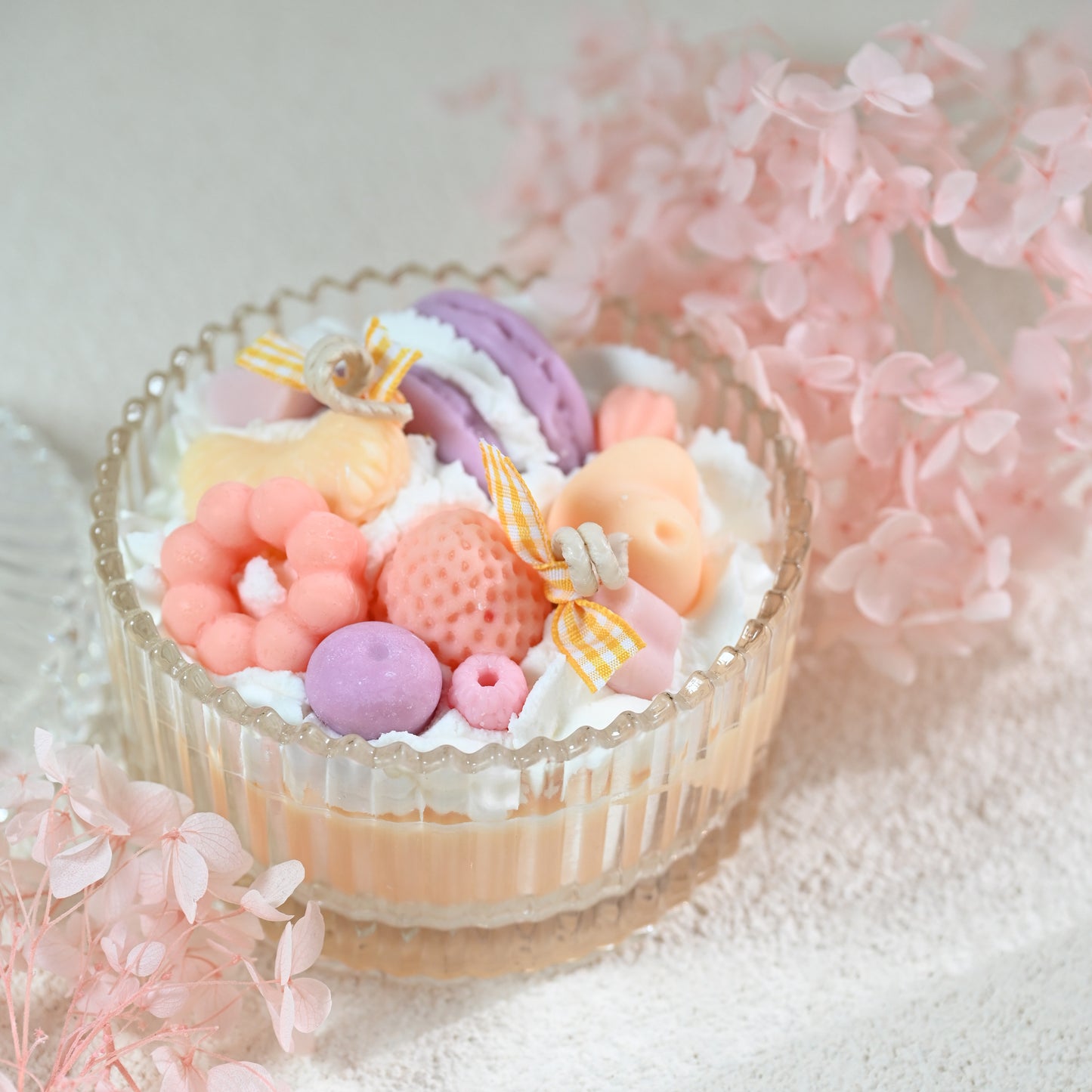 Side view of Miss Blooms Sweet Treats Bowl Candle in faceted crystal glass bowl