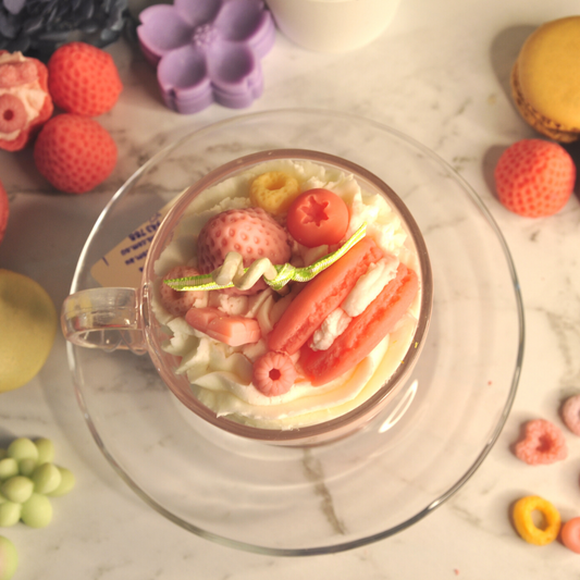 Miss Blooms Sweet Treats Tea Cup Candle styled with macarons and decorative props