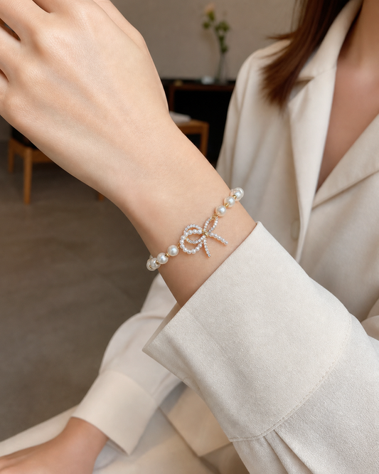 Gold Plated Bow Pearl Bracelet with Cubic Zirconia