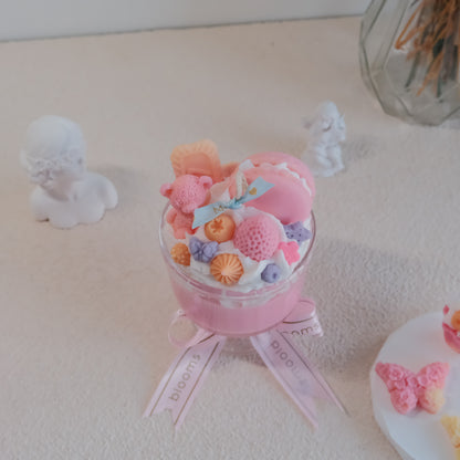 Close-up of Miss Blooms Giant Sundae Pink Candle showing bear and strawberry wax detail