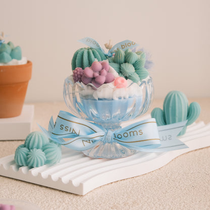 Miss Blooms Sweet Succulent Swirl Cactus Candle — pedestal compote glass with teal cactus, purple succulent and blue ribbon, Australian Bush soy candle Canberra