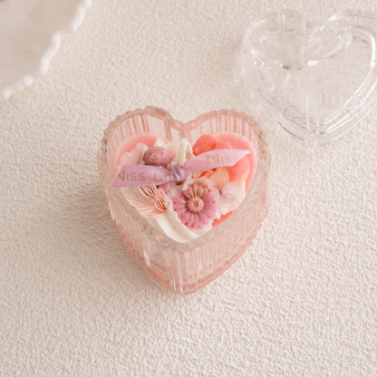 Miss Blooms Blossom Eternal Love Jar Candle — heart-shaped pink glass jar open showing mixed coral, pink and lavender wax flower arrangement