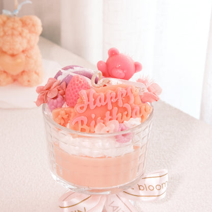 Close-up of Miss Blooms Giant Sundae Happy Birthday Candle showing Happy Birthday lettering and bear wax decoration