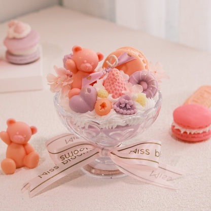 Miss Blooms Sweet Treats Large Sundae Candle in wide glass parfait bowl — teddy bear, macarons and berry wax art, Miss Blooms ribbon, macarons in background