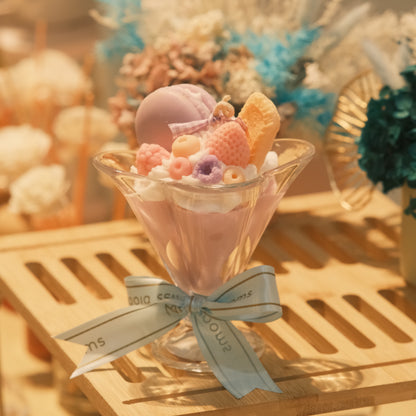 Miss Blooms Sweet Treats Cup Candle showing pink candle wax and pastel wax bear and treat decorations