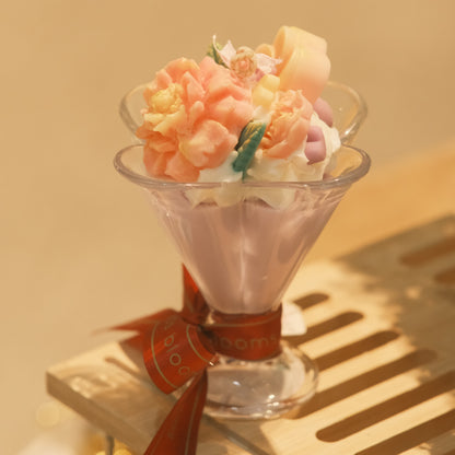 Miss Blooms Flower Cup Candle showing pink wax interior and floral arrangement with soft studio lighting