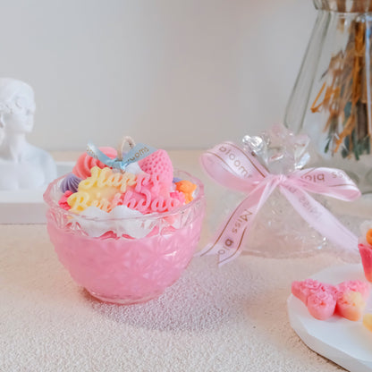 Top view of Miss Blooms Happy Birthday Candle showing rainbow-coloured wax decoration arrangement with Happy Birthday text