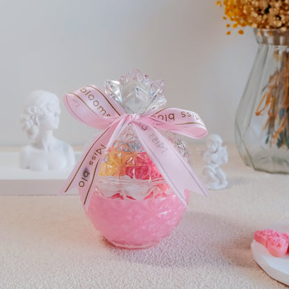 Miss Blooms Happy Birthday Candle side view showing pink faceted glass bowl and satin ribbon