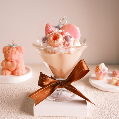 Miss Blooms Sweet Treats Ice Cream Cup Candle in tall fluted sundae glass with cream wax base, pink macaron and strawberry wax toppings, Miss Blooms gold satin ribbon