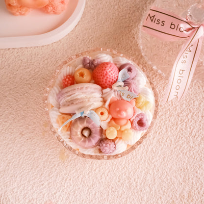 Miss Blooms Sweet Treats Bowl Candle side view on pink surface with other candle products