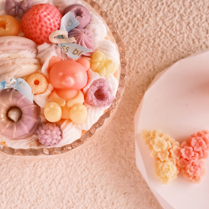Close-up of Miss Blooms Open Bowl Candle showing detailed wax fruit and flower decorations