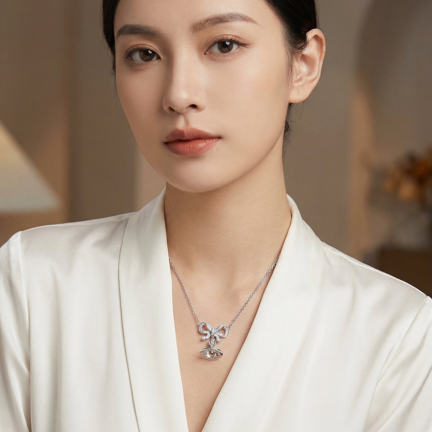 Sparkling Bow And Orb Necklace