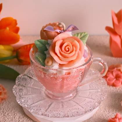 Miss Blooms Flower Premium Vintage Tea Cup Candle — side view of crystal teacup and saucer with peach rose wax arrangement