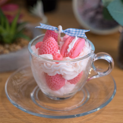 Close-up of Miss Blooms tea cup candle showing strawberry and cream wax decorations