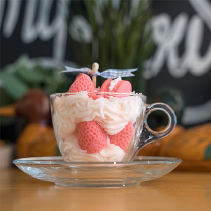 Miss Blooms Strawberry Tea Cup Candle displayed with other dessert candles in home setting